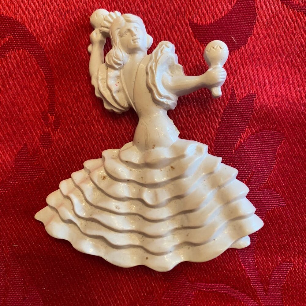 1950's White Pin of a Women with Maracas Dancing possibly the Merengue